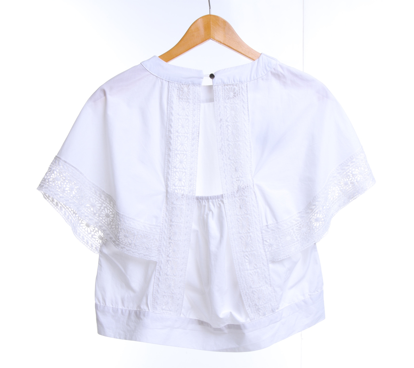 This is April White Crop Top Back Blouse