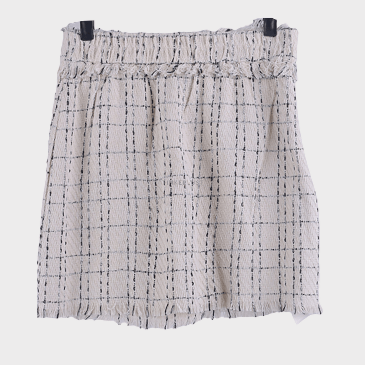 This is April Beige & Black Mini Skirt