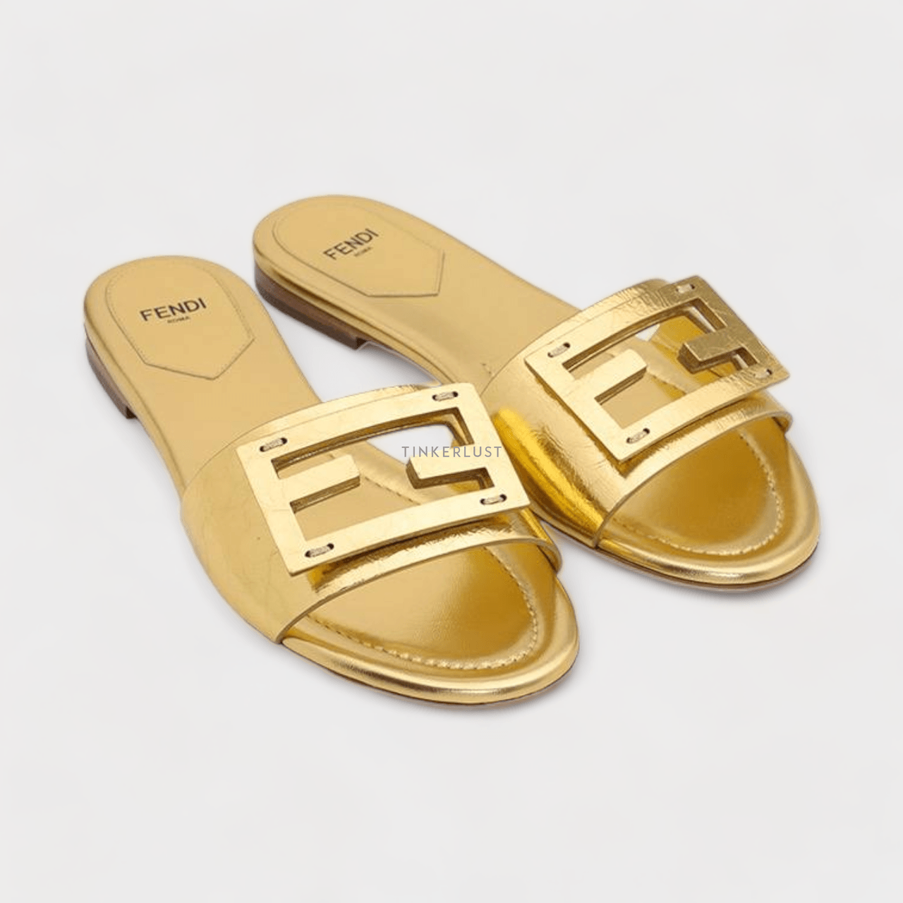 Fendi Women Siganture FF Baguette Slide Sandals in Gold Laminated Nappa Leather