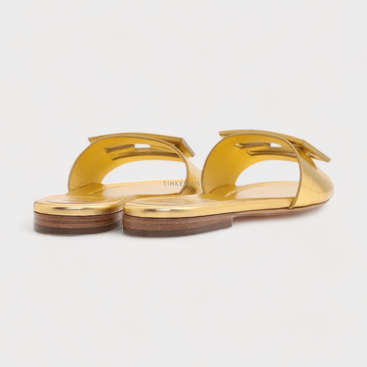 Fendi Women Siganture FF Baguette Slide Sandals in Gold Laminated Nappa Leather