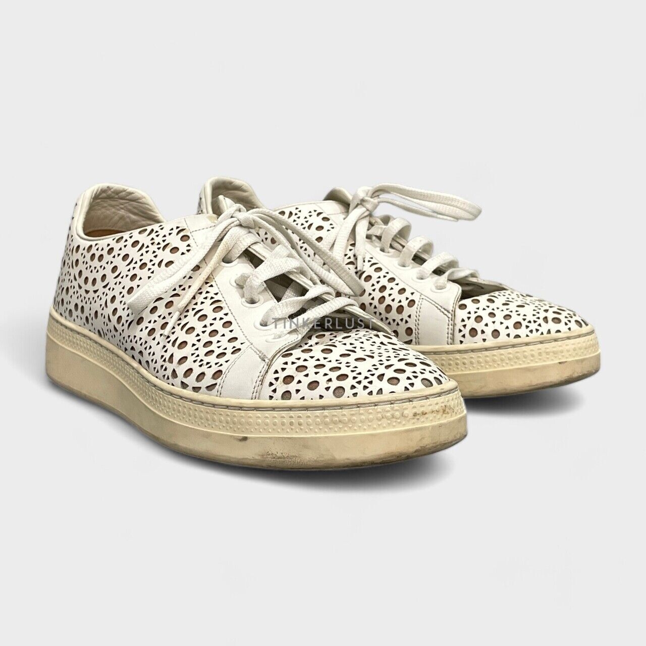 Alaia Laser Cut Leather Lace Up White Sneakers