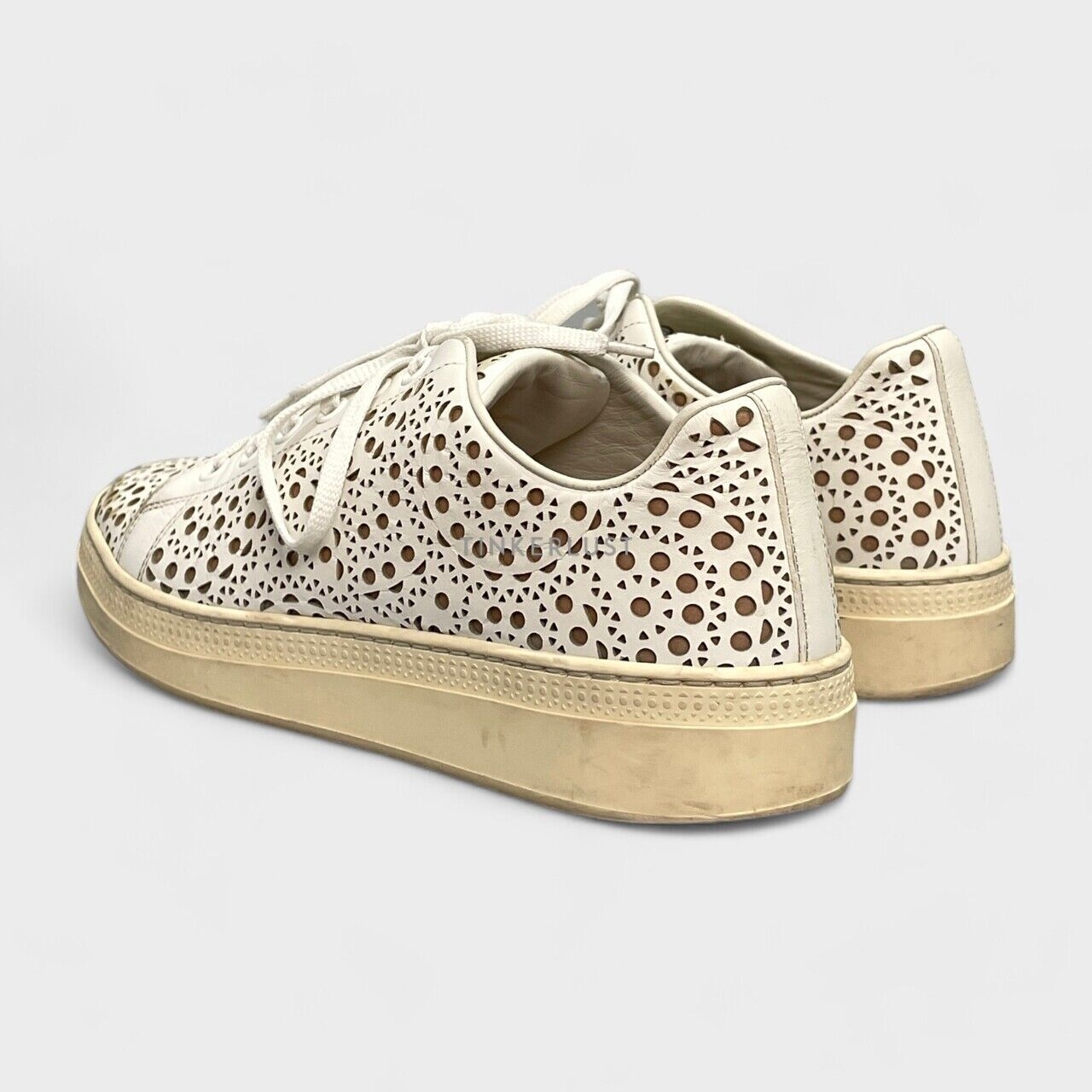 Alaia Laser Cut Leather Lace Up White Sneakers