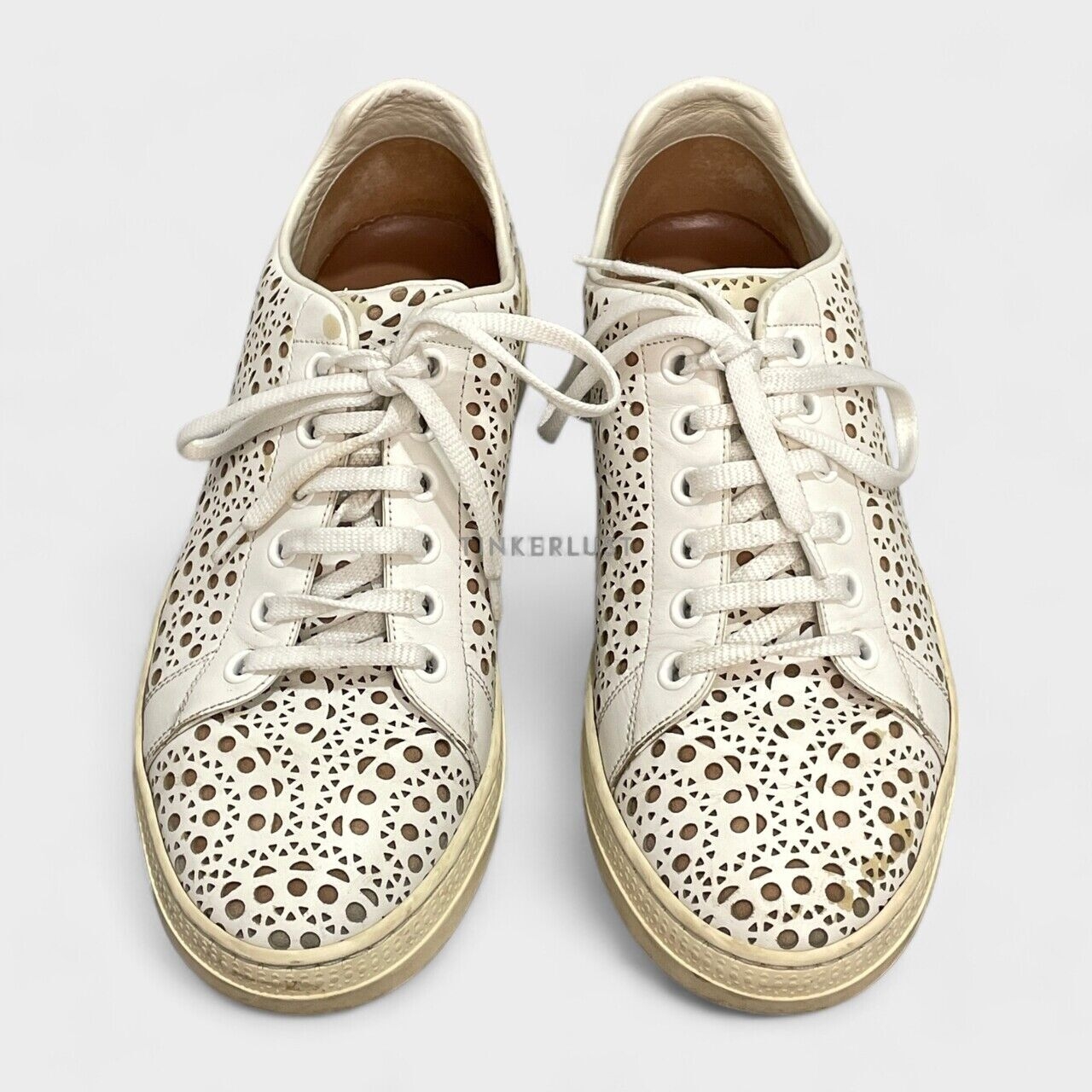 Alaia Laser Cut Leather Lace Up White Sneakers