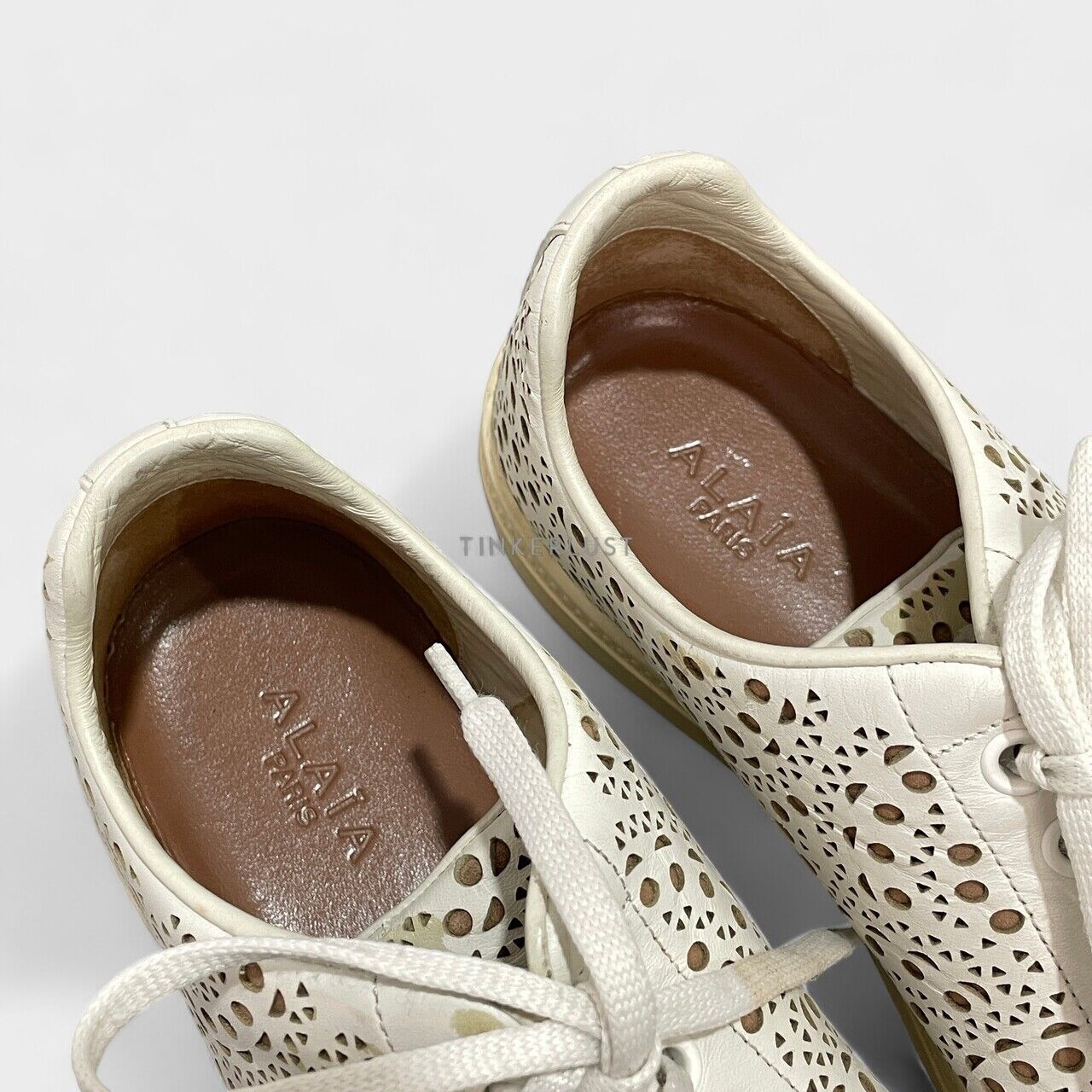 Alaia Laser Cut Leather Lace Up White Sneakers