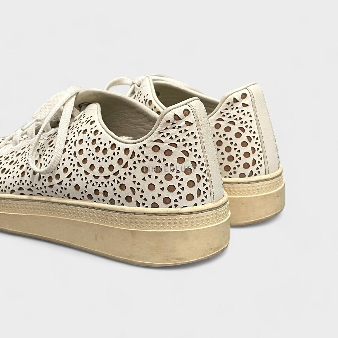 Alaia Laser Cut Leather Lace Up White Sneakers